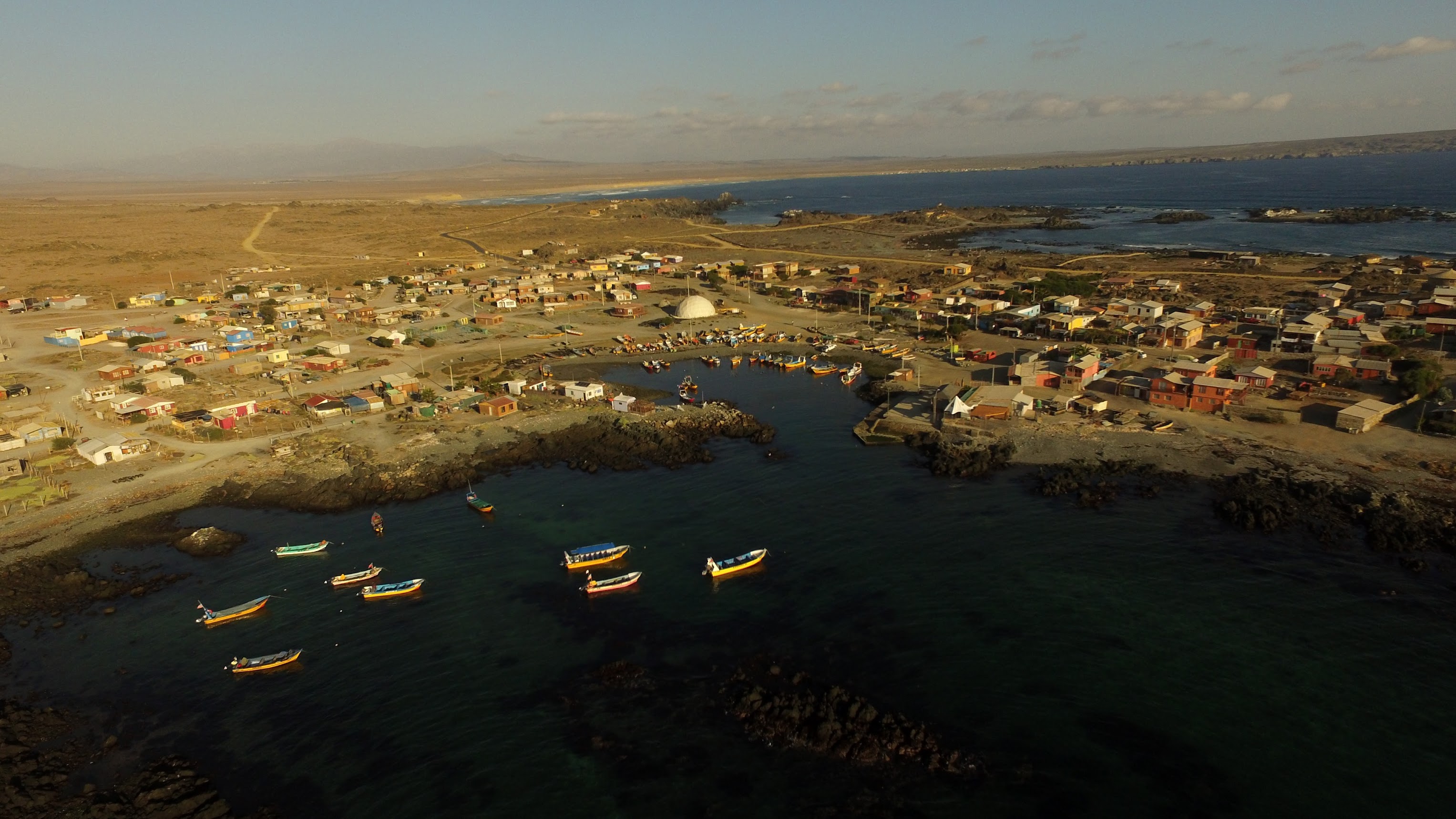 Fishing boats moored at a cove on Chile's northern desert coast