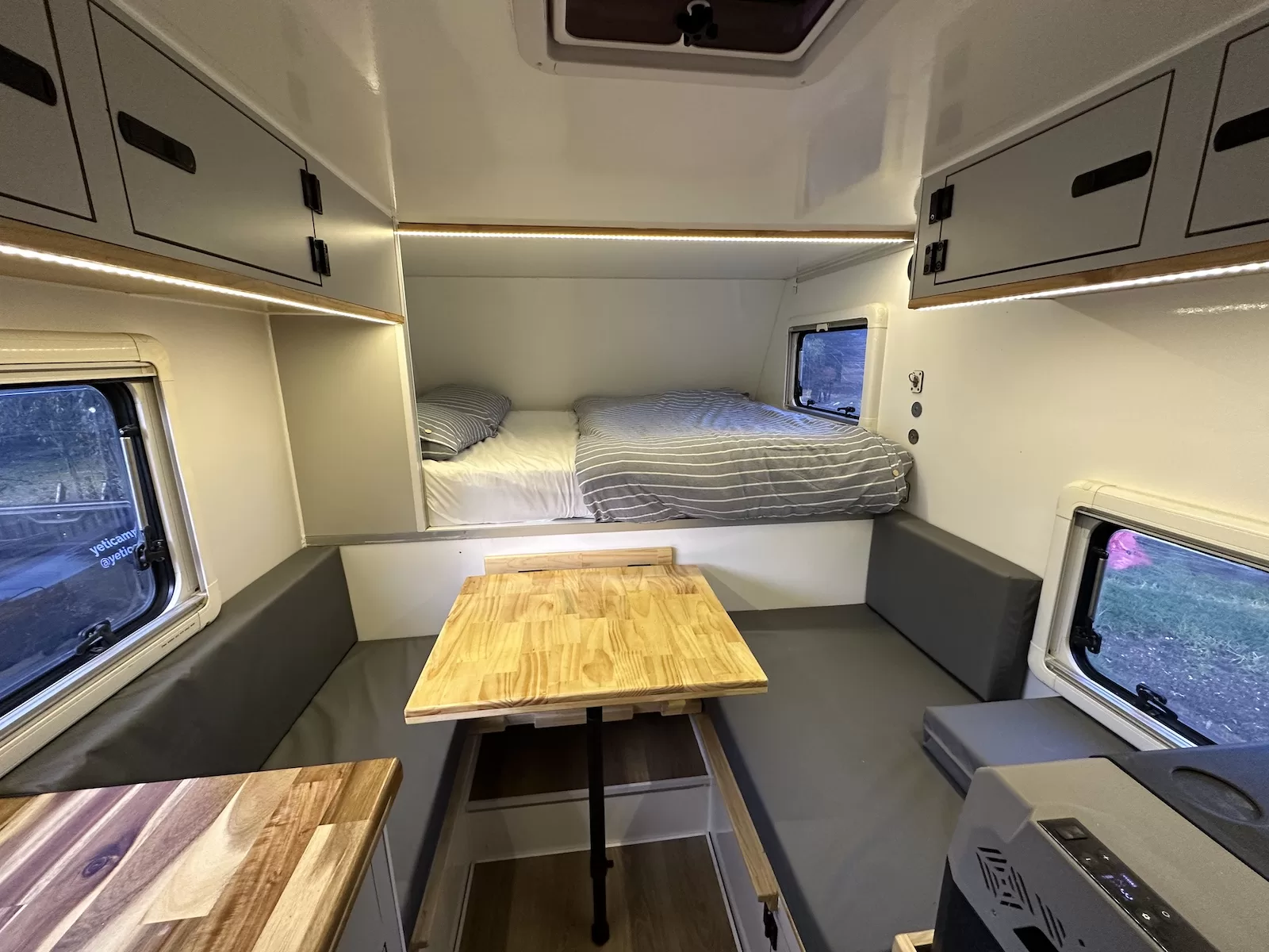 Interior with bed and dining table